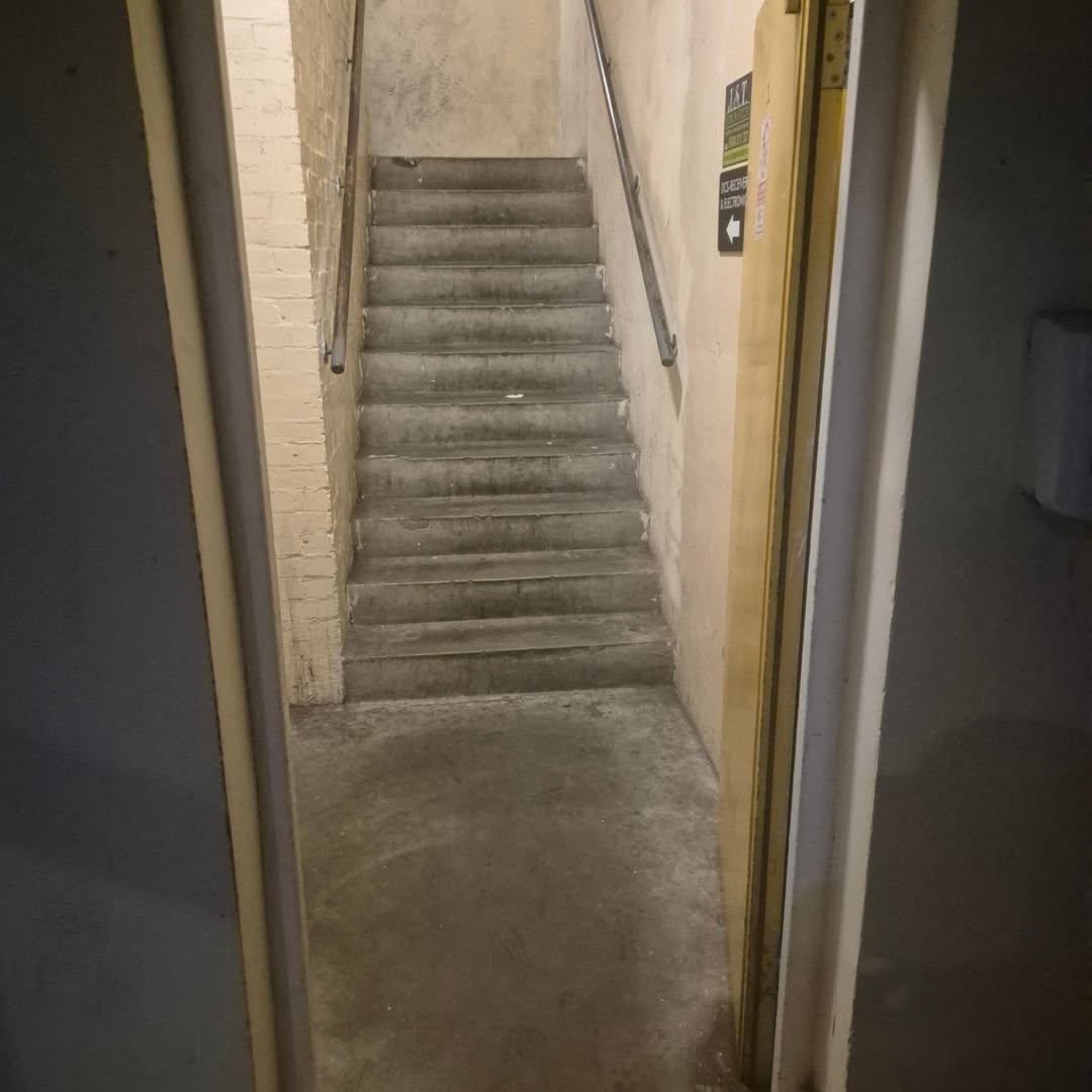 Concrete staircase leading up to the third floor