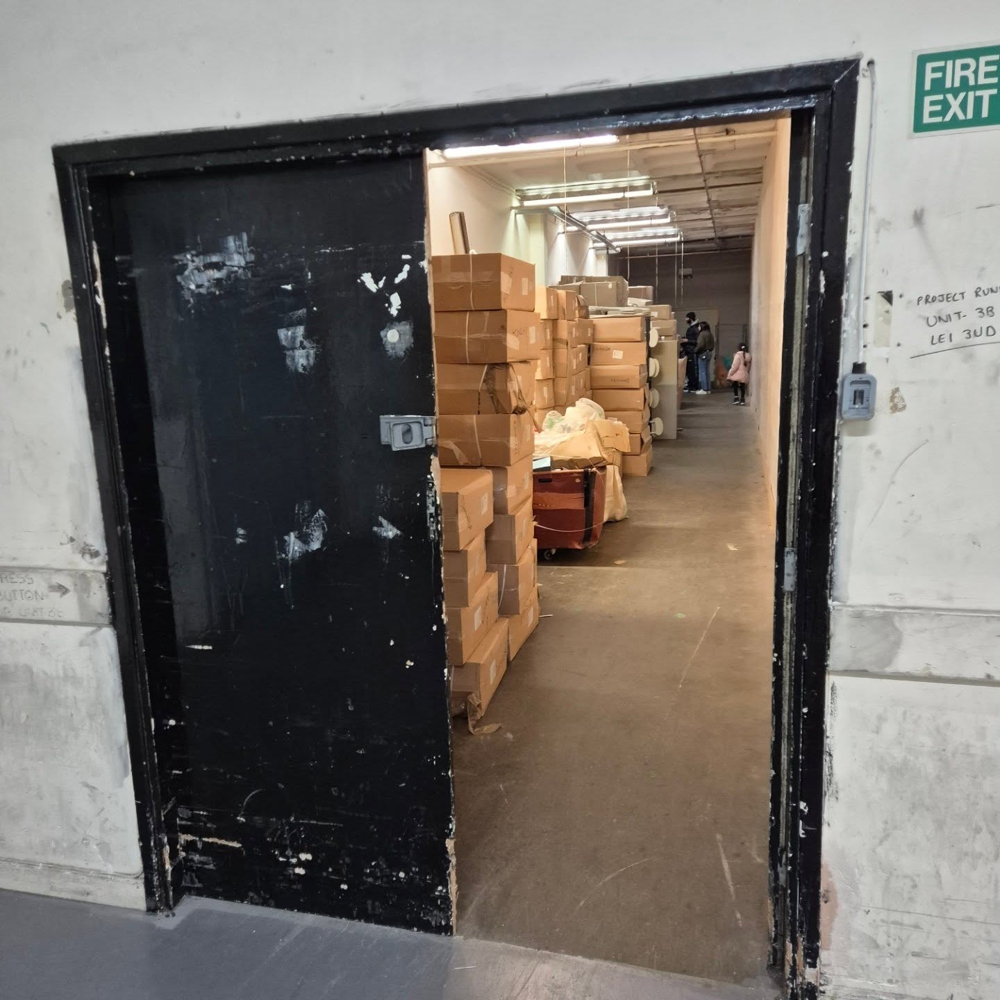 Double black doors marked Unit 3B on the third floor