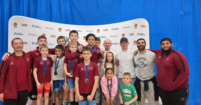 Junior squad with medals in club tracksuits