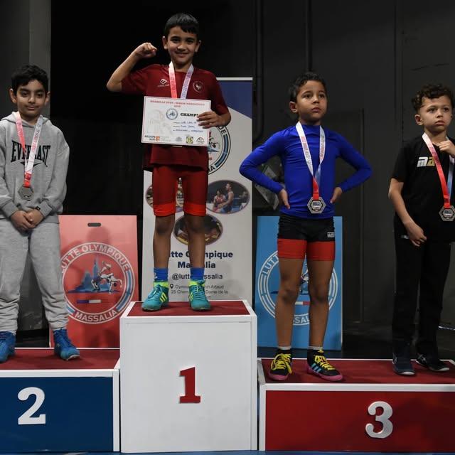 Junior wrestler on top of the podium at an international open in Marseille